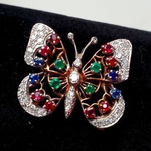 Brooch 18kt. Diamonds, ruby and Emeralds.